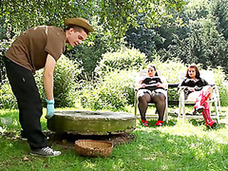 Fat lady and her hoe of a friend ball gag a guy in the backyard