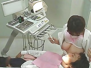 Vicious Japanese Dentist Jerks Off Her Clients While They Suck Her Big Jugs